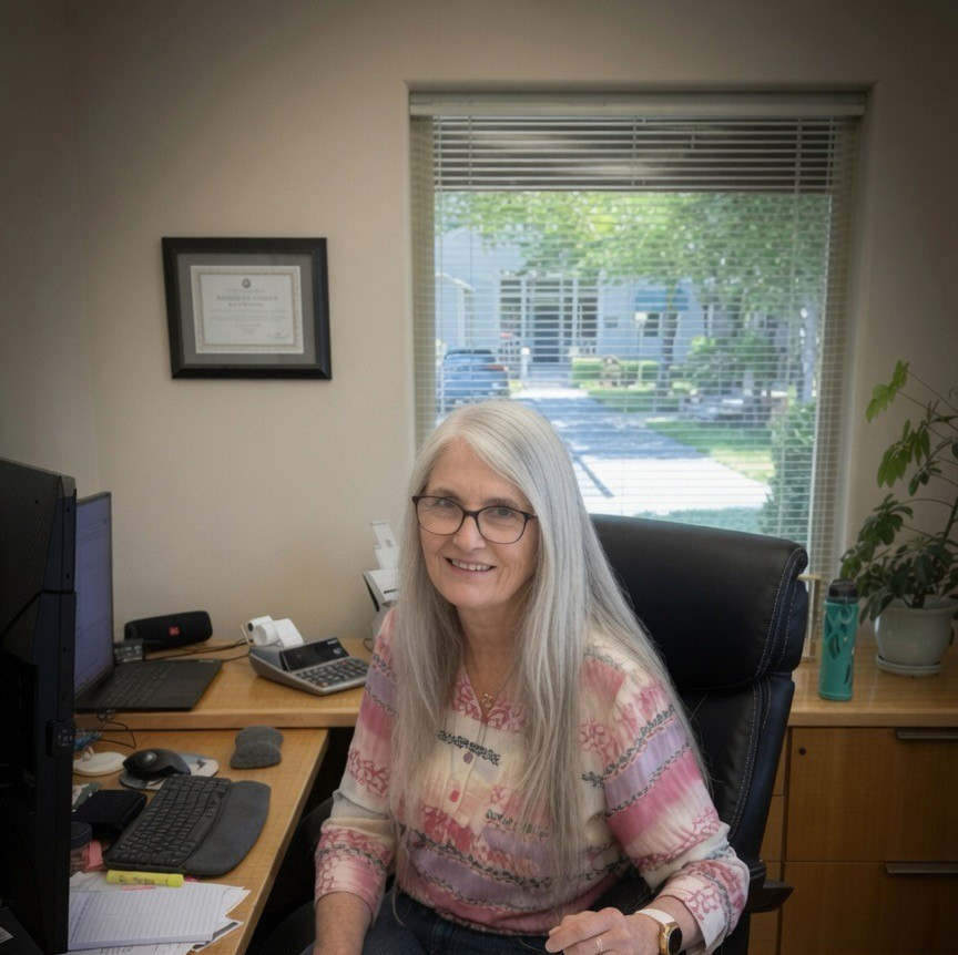 Rocky at her desk, preparing a tax return